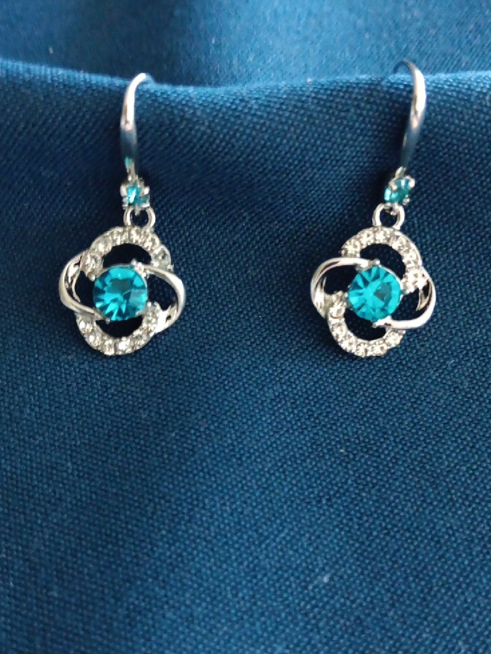 Silver Floral Drop Earrings with Teal Crystal Accent